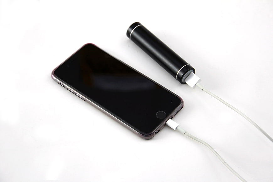 black-smartphone-charging-with-portable-power-bank-on-white-background.jpg