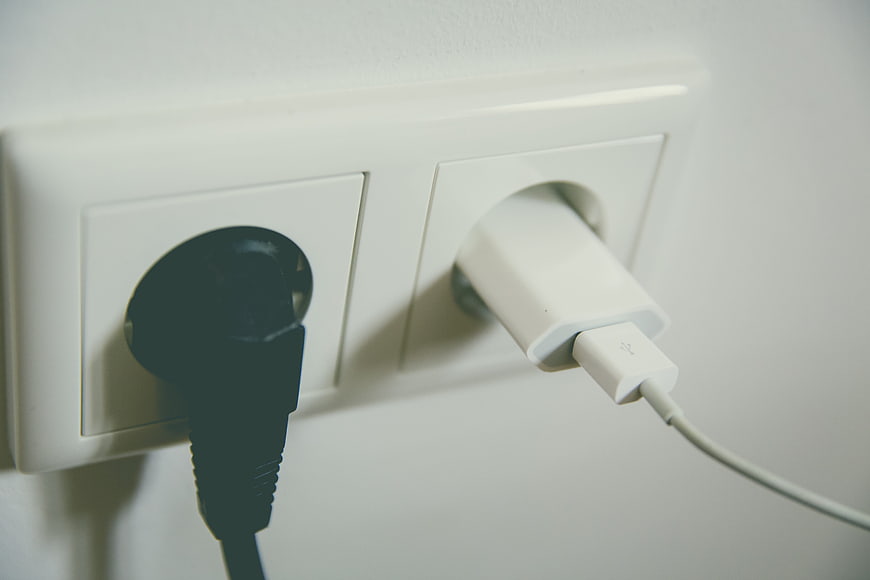 close-up-of-black-and-white-plugs-in-a-european-wall-socket.jpg